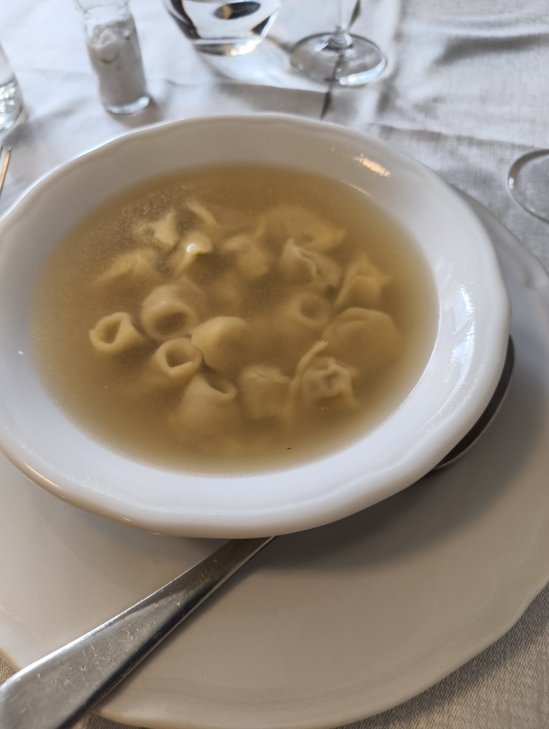 Cremonese marubini served in a clear broth