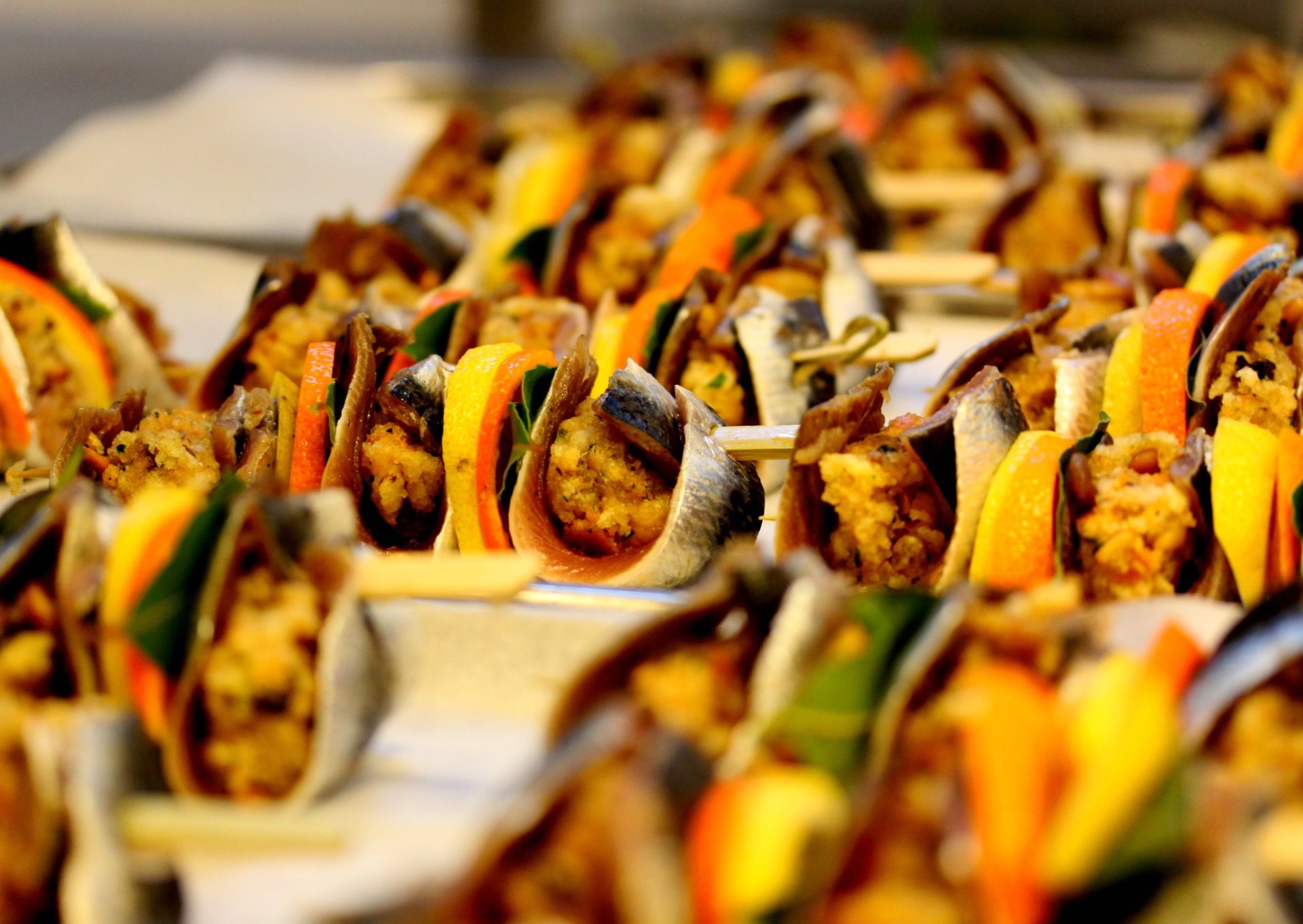 Skewers of stuffed, rolled sarde a beccafico